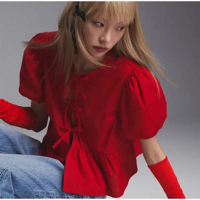 Rosa | Blusa alla moda con stampa leopardata e maniche a sbuffo